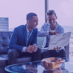 Businessman smiling at computer