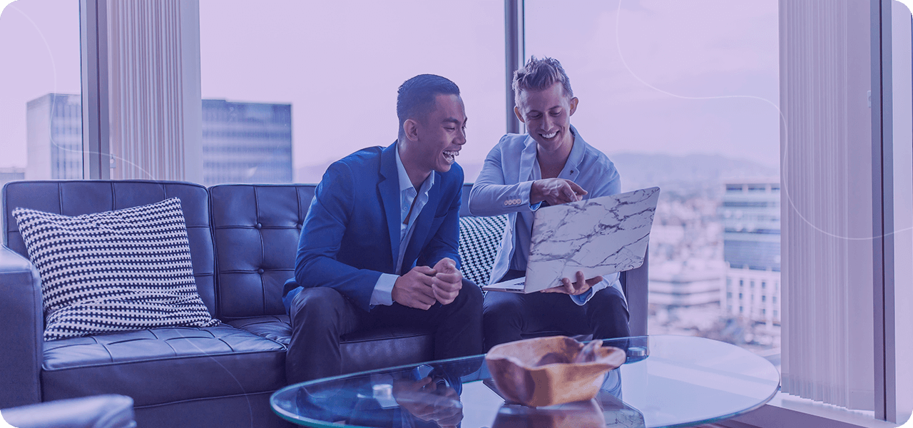 Businessman smiling at computer